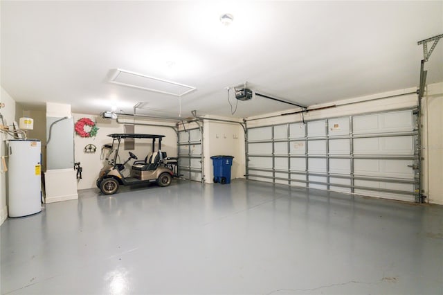 garage featuring water heater and a garage door opener