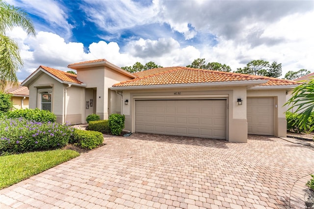 mediterranean / spanish-style house featuring a garage