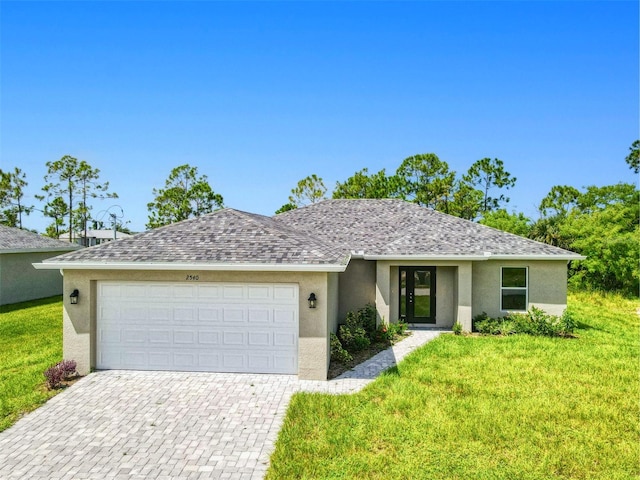 ranch-style home with a garage and a front lawn