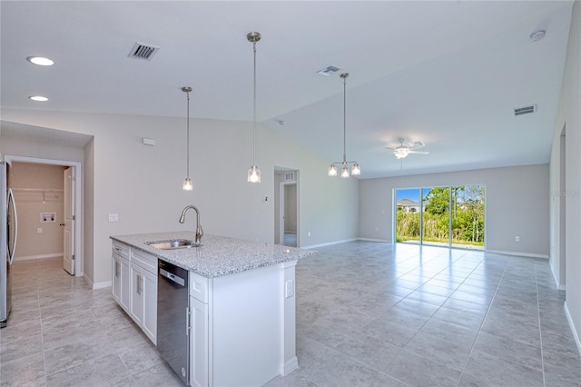 kitchen featuring light stone counters, white cabinets, sink, stainless steel appliances, and vaulted ceiling