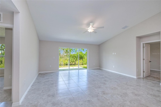 tiled empty room with vaulted ceiling and ceiling fan