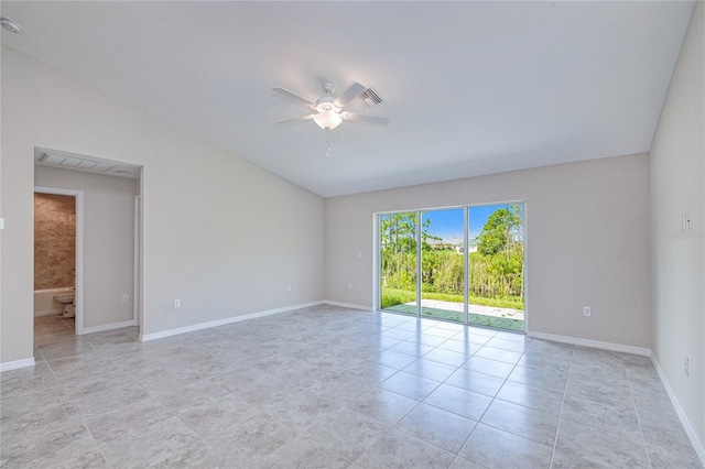 empty room featuring ceiling fan, lofted ceiling, and light tile patterned floors