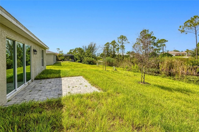 view of yard with a patio area