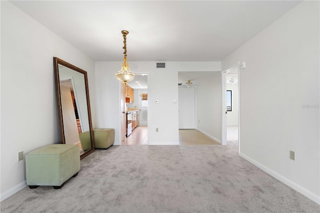 carpeted empty room with ceiling fan