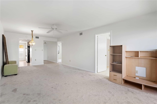 unfurnished living room with light carpet and ceiling fan