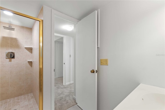 bathroom featuring a shower with shower door