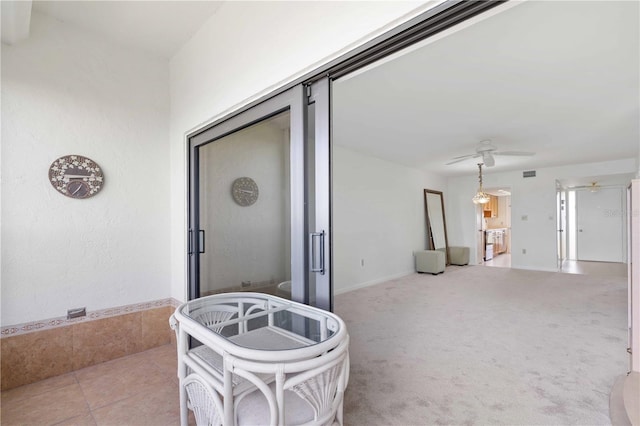 view of patio / terrace featuring ceiling fan