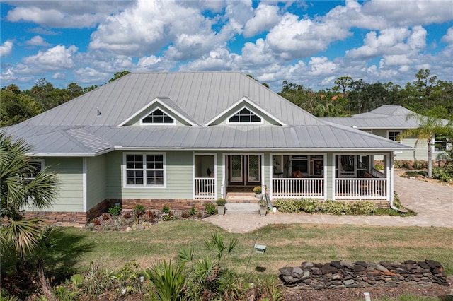 view of front of house with a front lawn and a porch