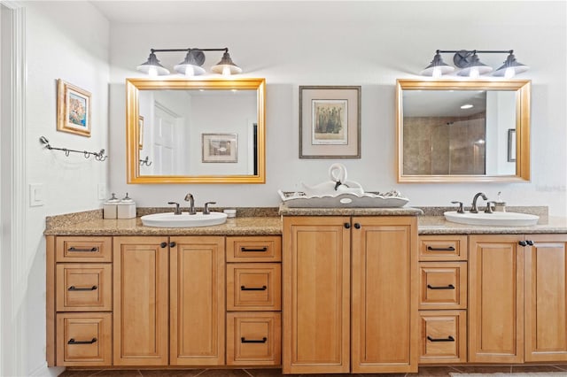 bathroom featuring tile patterned floors, walk in shower, and vanity