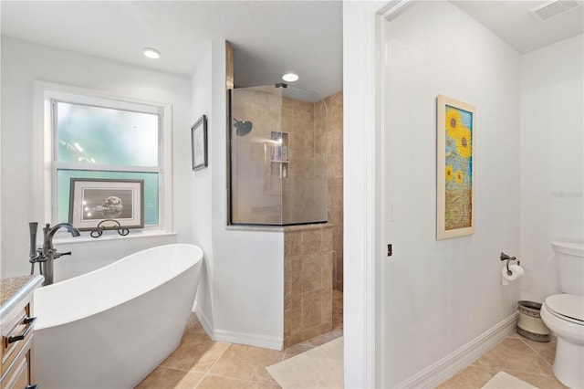 full bathroom with independent shower and bath, vanity, toilet, and tile patterned floors