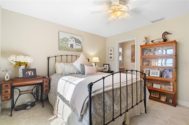 bedroom featuring ceiling fan and light carpet