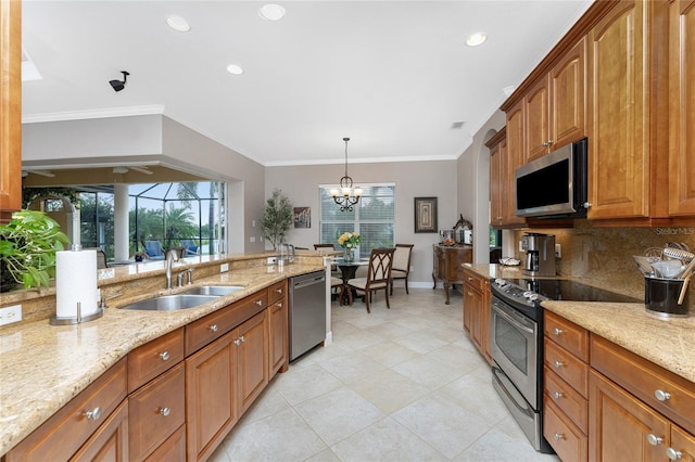 kitchen featuring light stone counters, stainless steel appliances, an inviting chandelier, and sink