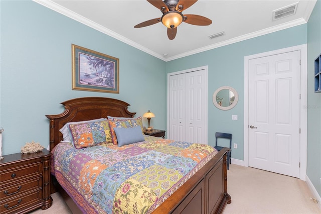 carpeted bedroom with a closet, ceiling fan, and crown molding