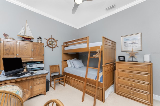 carpeted bedroom featuring ceiling fan and ornamental molding