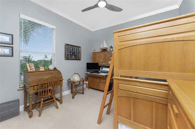 carpeted home office featuring ceiling fan and ornamental molding