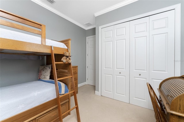 bedroom featuring light carpet, a closet, and ornamental molding