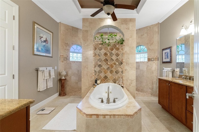 bathroom featuring tiled tub, vanity, a healthy amount of sunlight, and ornamental molding