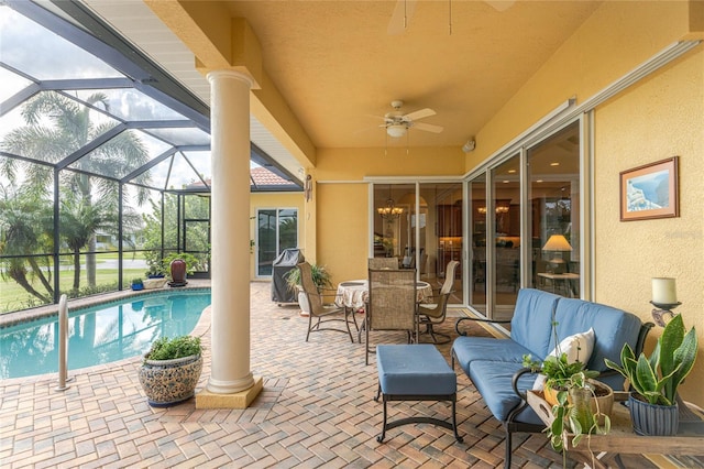 view of patio / terrace with outdoor lounge area, ceiling fan, and a lanai