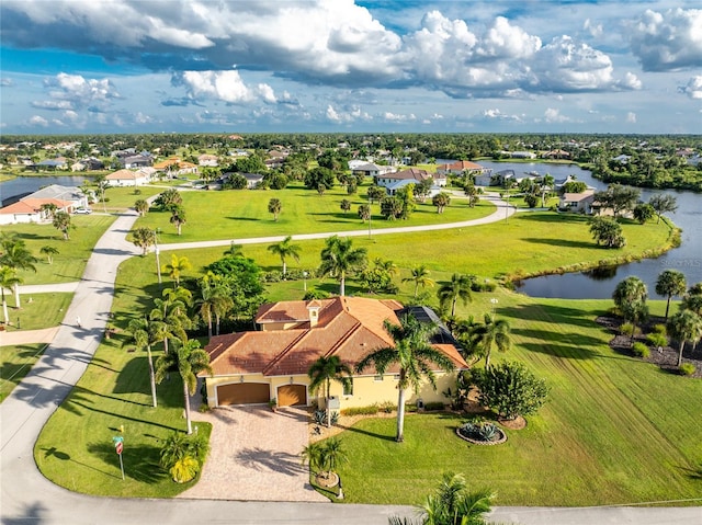 birds eye view of property with a water view