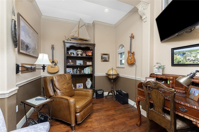 living area with crown molding and dark hardwood / wood-style floors