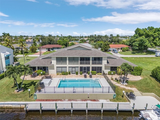 exterior space with a patio, a water view, and a yard