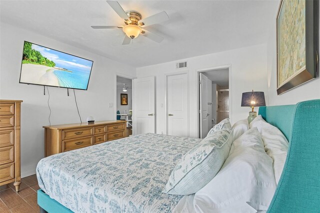 bedroom featuring connected bathroom and ceiling fan