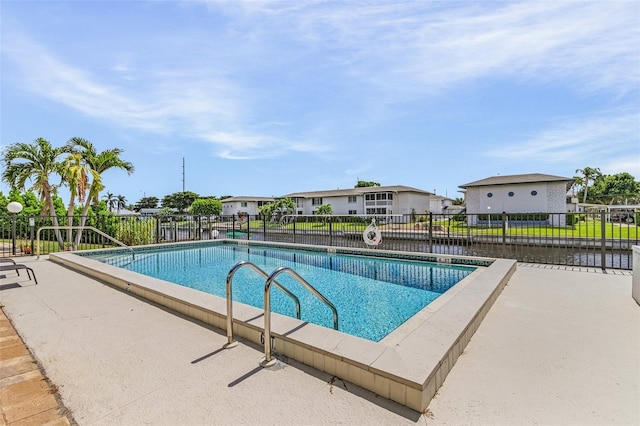 view of swimming pool featuring fence and a fenced in pool
