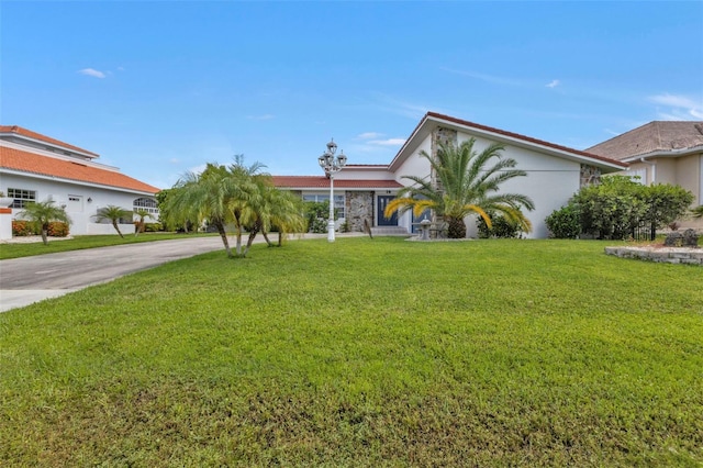 view of front facade featuring a front yard and a garage