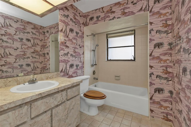 full bathroom with tiled shower / bath combo, tile patterned flooring, vanity, and toilet