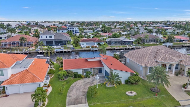 birds eye view of property with a water view