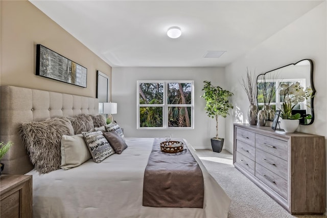 bedroom with light carpet