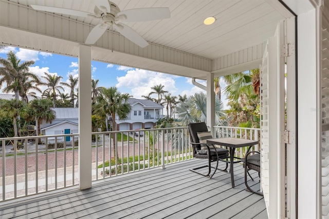 wooden terrace featuring ceiling fan