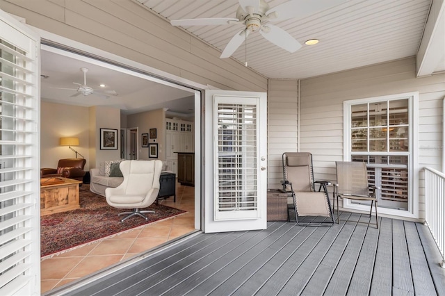 wooden deck with ceiling fan