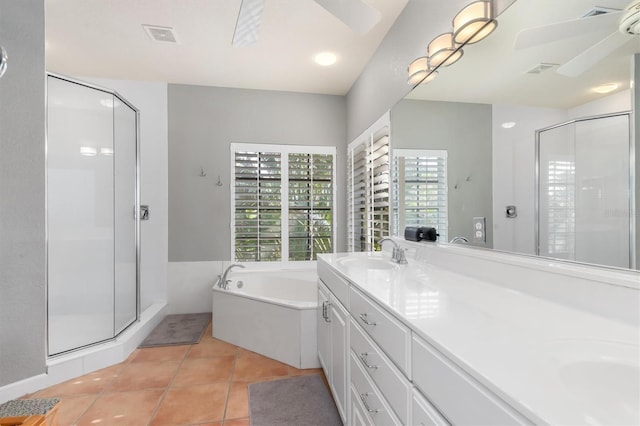 bathroom featuring ceiling fan, vanity, independent shower and bath, and tile patterned flooring