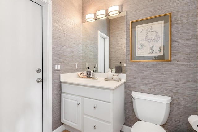 bathroom with toilet and vanity