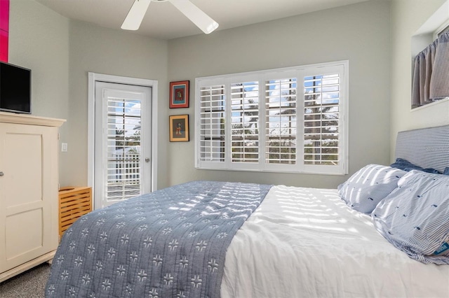 bedroom featuring access to exterior, ceiling fan, and carpet floors