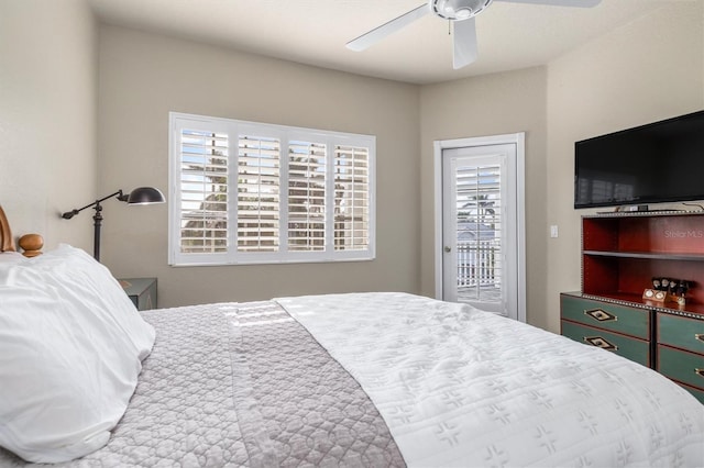 bedroom with ceiling fan and access to outside