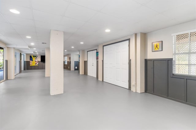 basement featuring a paneled ceiling