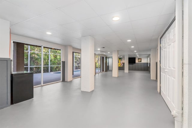 basement featuring a paneled ceiling