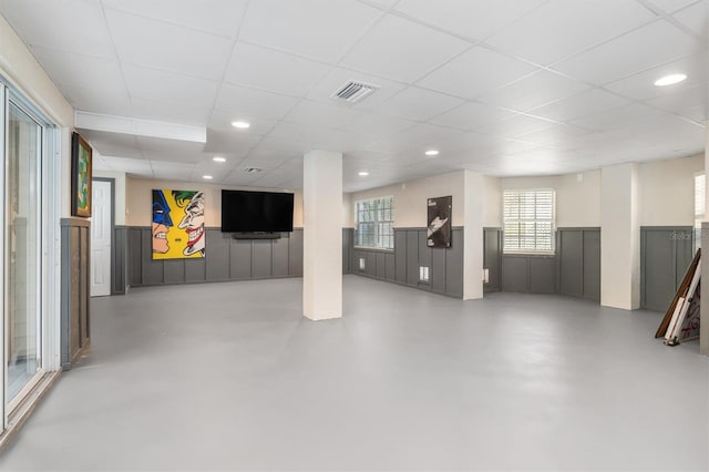 basement with a paneled ceiling