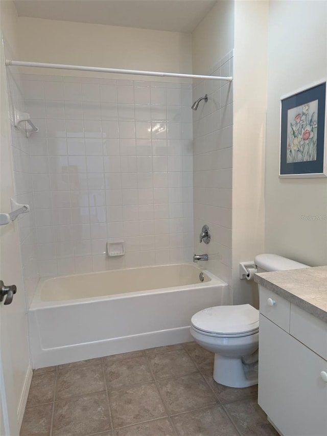 bathroom featuring shower / bathtub combination, vanity, toilet, and tile patterned floors