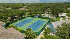 view of sport court featuring fence