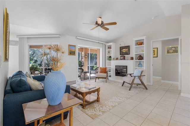 tiled living room featuring lofted ceiling, ceiling fan, and built in features