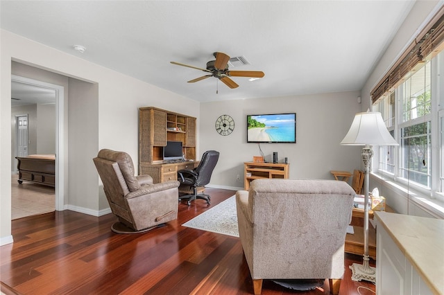 living room featuring ceiling fan and dark hardwood / wood-style floors