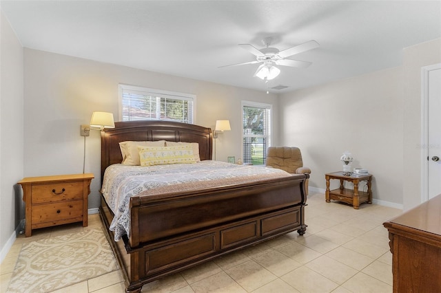 tiled bedroom featuring ceiling fan