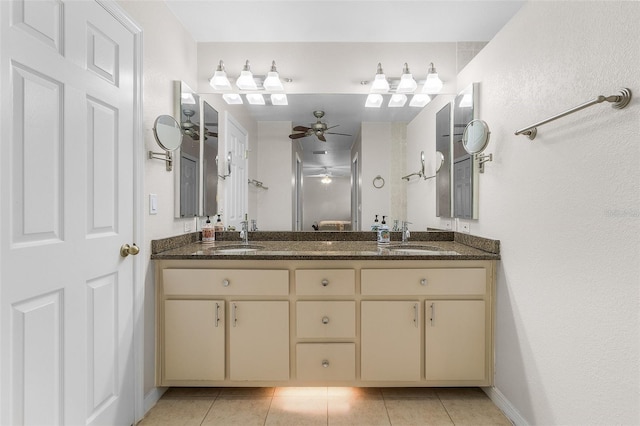 bathroom featuring tile patterned flooring, vanity, and ceiling fan