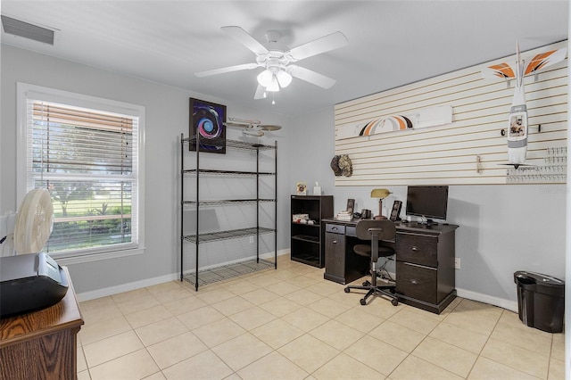 office space with ceiling fan and light tile patterned floors