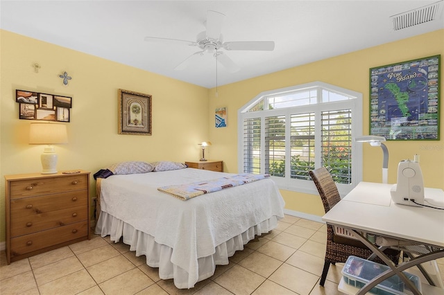 tiled bedroom featuring ceiling fan