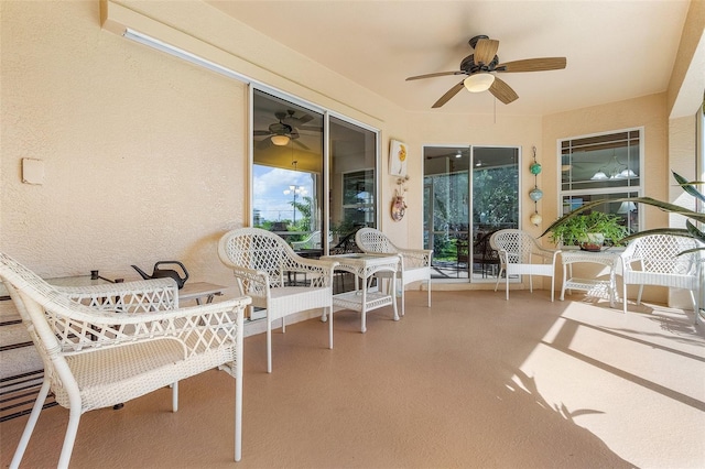 sunroom / solarium with ceiling fan