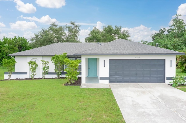 ranch-style home featuring a garage and a front lawn